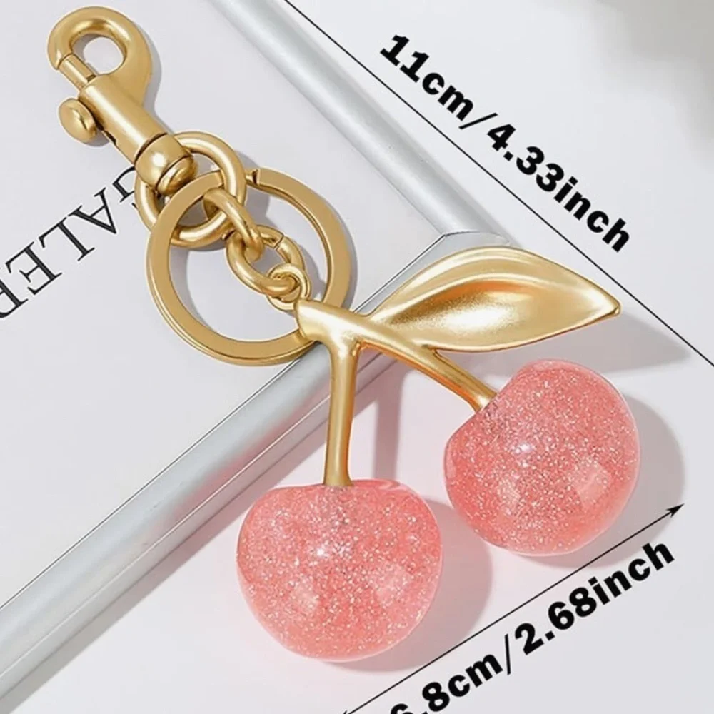 Cherry Pink sparkles with gold leaf clips onto your coach purse